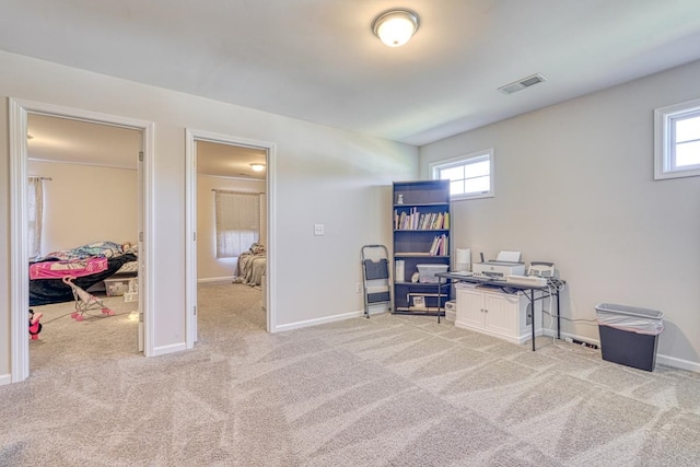 home office featuring light carpet and a wealth of natural light