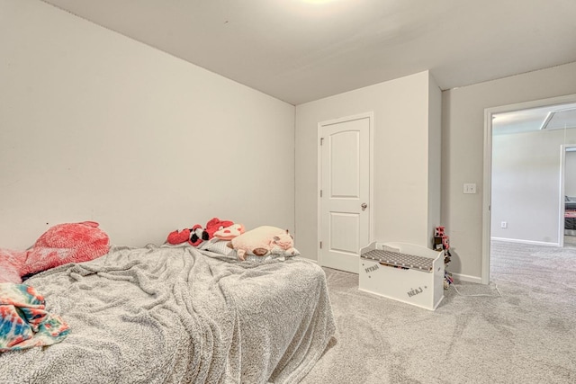 bedroom featuring light colored carpet