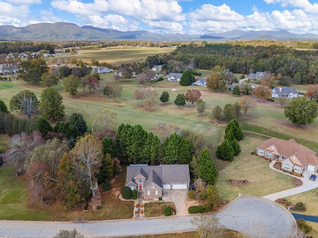 birds eye view of property featuring a mountain view