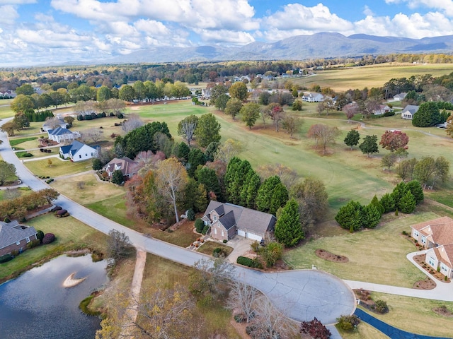 drone / aerial view with a water and mountain view