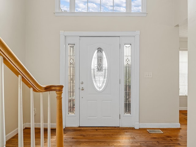 foyer entrance with hardwood / wood-style floors