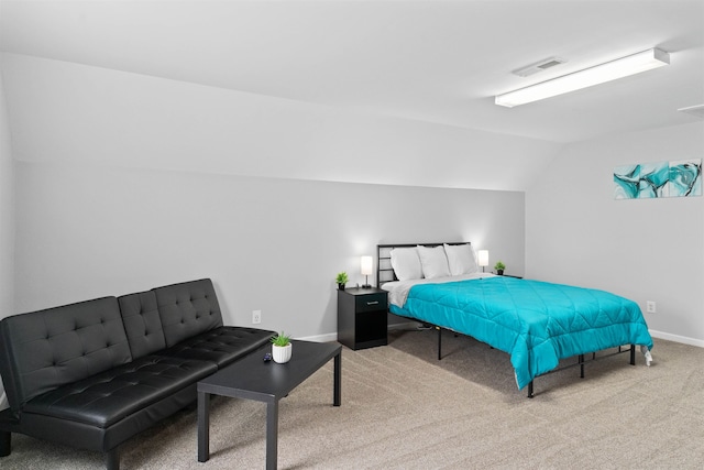 carpeted bedroom featuring lofted ceiling