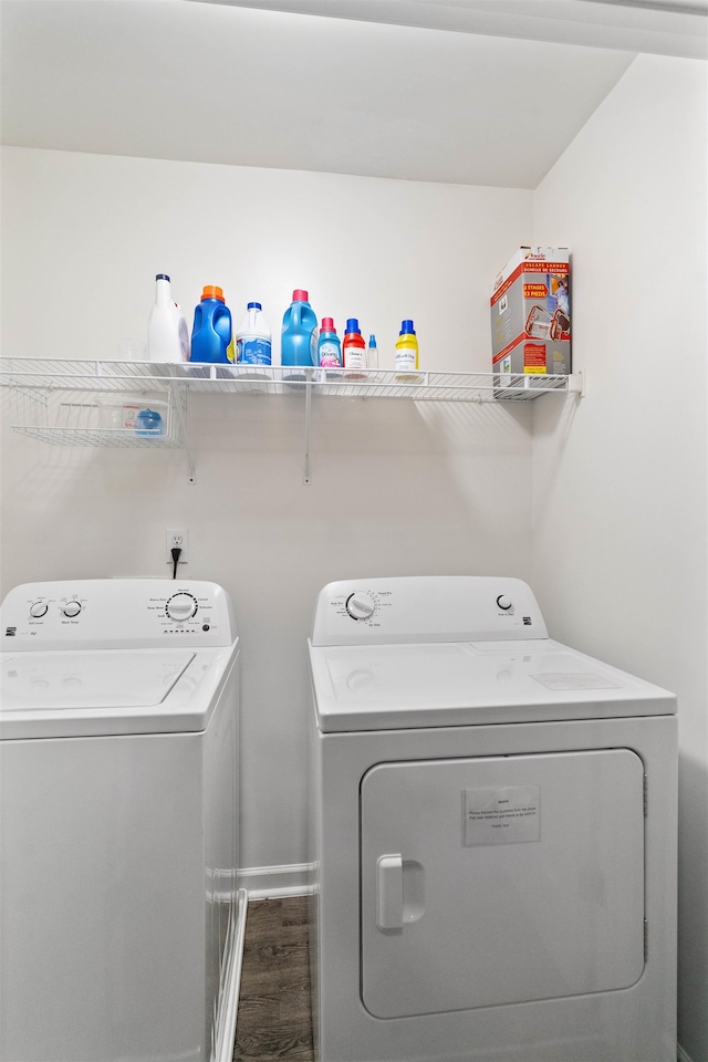 laundry room with washer and clothes dryer and hardwood / wood-style floors