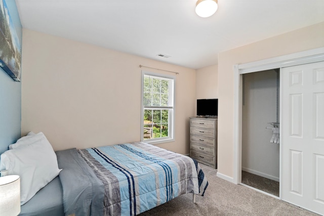 carpeted bedroom with a closet