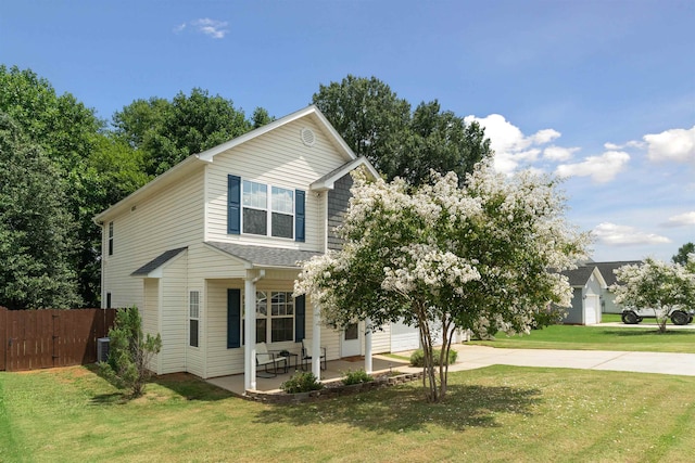 view of front of property with a front yard, a garage, and central air condition unit