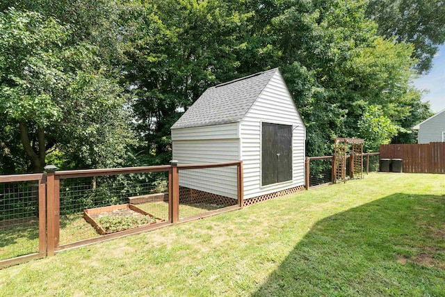 view of outbuilding featuring a lawn