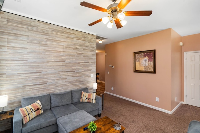 unfurnished living room with ceiling fan and carpet flooring