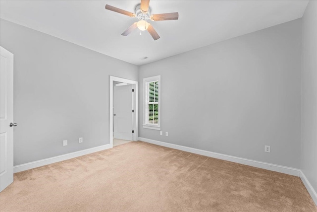 carpeted empty room with ceiling fan