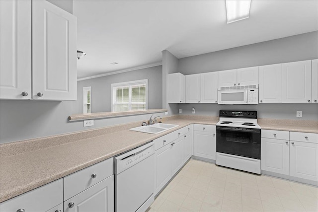 kitchen with ornamental molding, sink, white cabinets, and white appliances