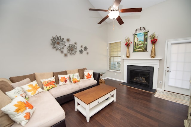 living room with ceiling fan, high vaulted ceiling, and dark hardwood / wood-style flooring