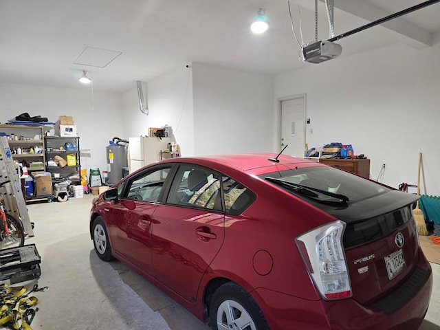 garage with a garage door opener and water heater