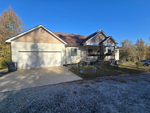 view of front of house featuring a porch and a garage