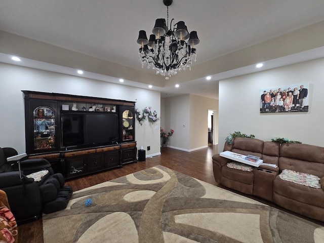 living room featuring dark wood-type flooring and a chandelier