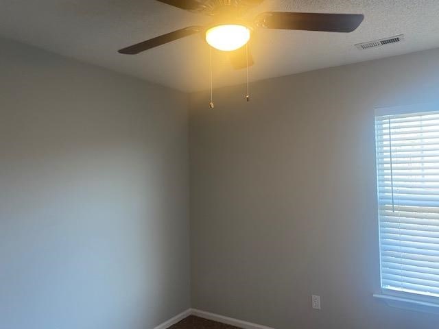 spare room with ceiling fan