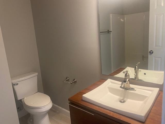 bathroom featuring toilet and vanity