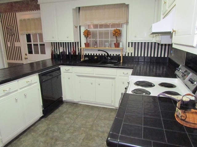 kitchen featuring white cabinetry, kitchen peninsula, dishwasher, and sink