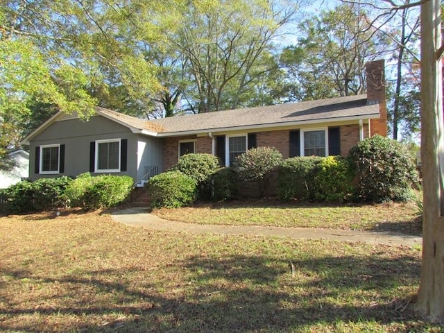 ranch-style home with a front yard