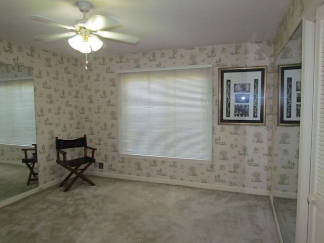 unfurnished room featuring carpet flooring and ceiling fan