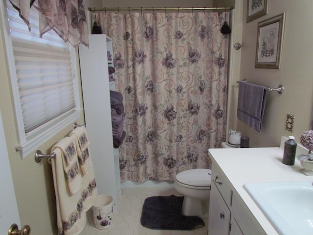 full bathroom with vanity, toilet, and shower / bath combination with curtain