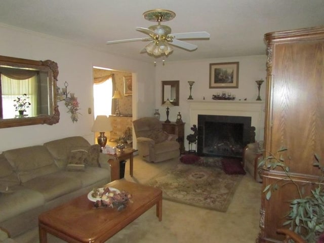 carpeted living room featuring a wealth of natural light and ceiling fan