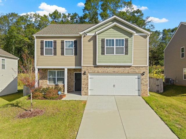 view of front of home featuring a garage, a front lawn, and central air condition unit