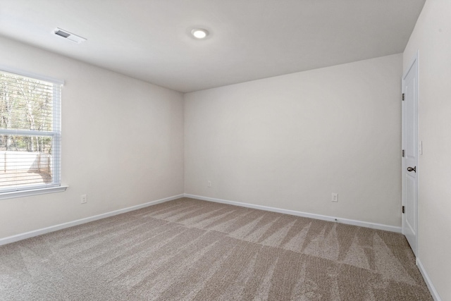 unfurnished room featuring carpet floors