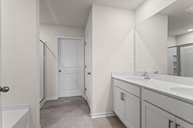 bathroom with vanity and an enclosed shower