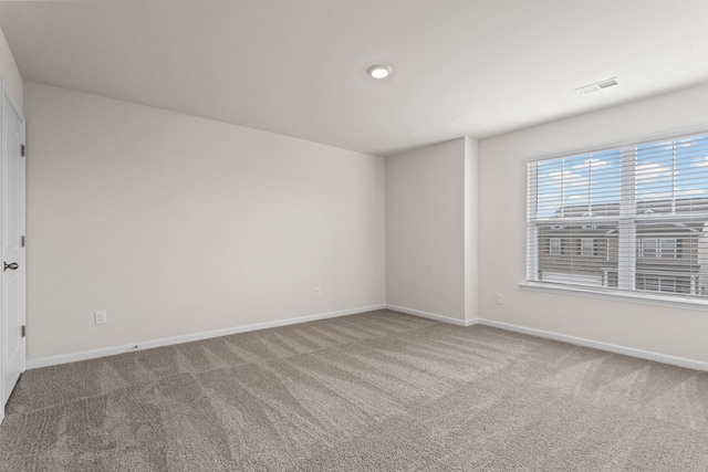 unfurnished room with carpet flooring