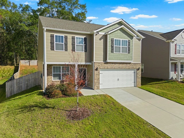 view of front of house with a garage and a front lawn