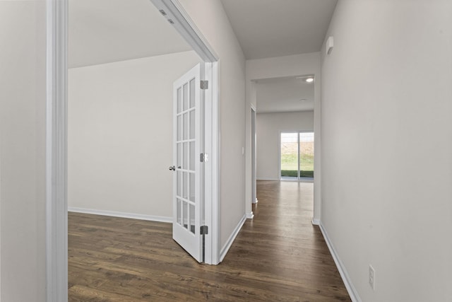 hall with dark hardwood / wood-style flooring