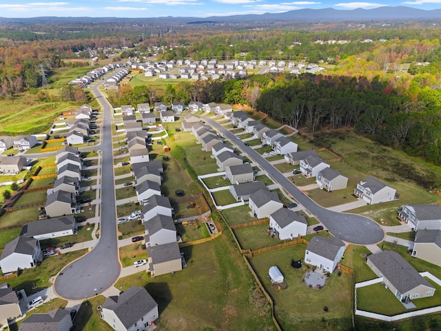 birds eye view of property featuring a mountain view