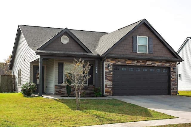 craftsman inspired home featuring a garage, a front lawn, and covered porch