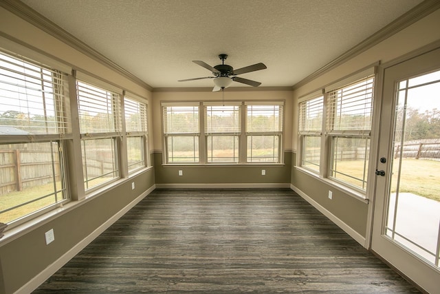 unfurnished sunroom with ceiling fan