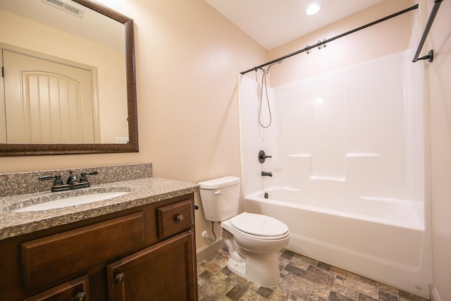 full bathroom with vanity, washtub / shower combination, and toilet