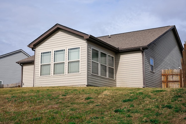 view of side of property featuring a lawn