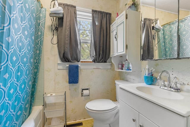 full bathroom featuring vanity, toilet, and shower / tub combo