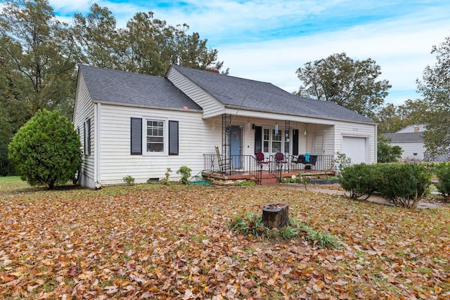 view of front of property featuring a garage and a porch