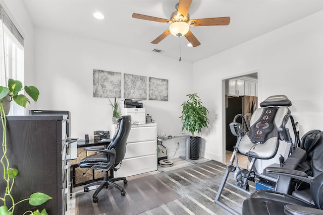 office space with wood-type flooring and ceiling fan