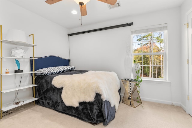 carpeted bedroom with ceiling fan