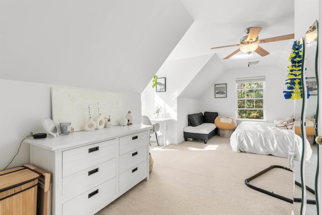 carpeted bedroom featuring vaulted ceiling and ceiling fan