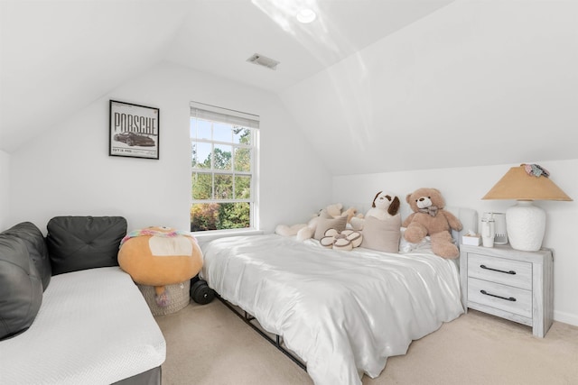 carpeted bedroom with vaulted ceiling