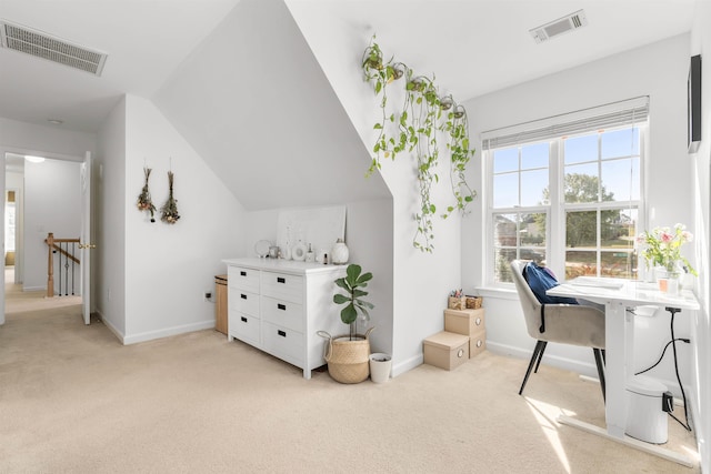 office area with light colored carpet and lofted ceiling