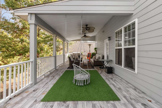 exterior space featuring ceiling fan and an outdoor living space