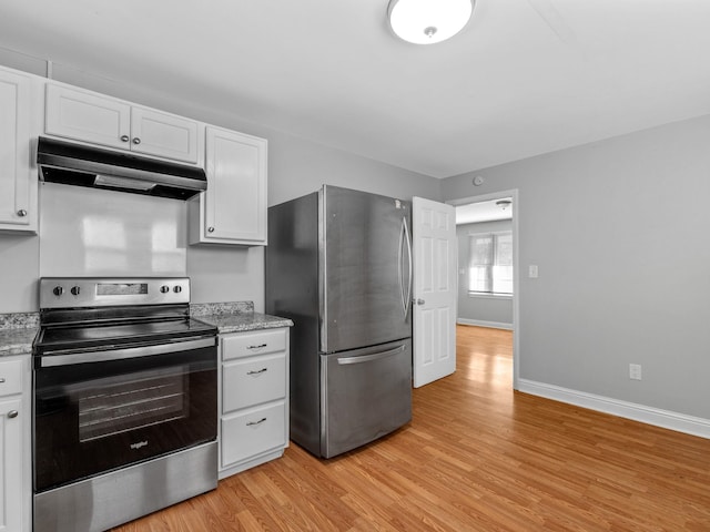 kitchen with stainless steel appliances, light hardwood / wood-style floors, white cabinets, and light stone counters