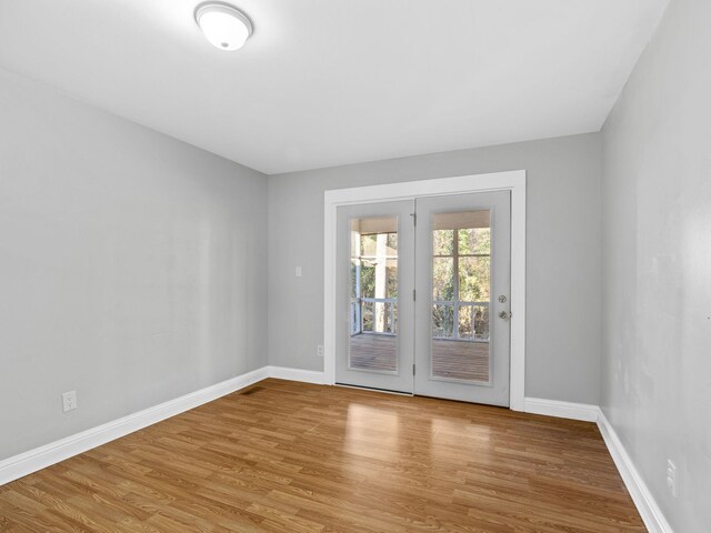 unfurnished room featuring light wood-type flooring