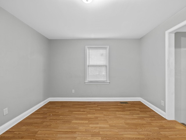 spare room with light hardwood / wood-style flooring