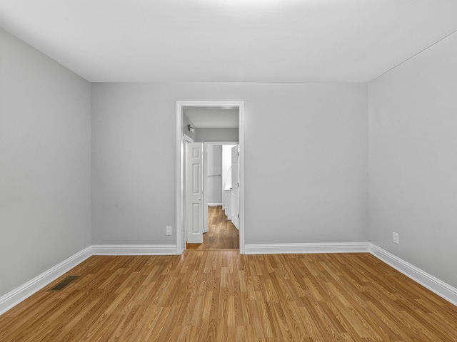 spare room featuring light hardwood / wood-style floors