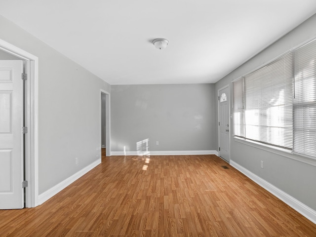 spare room featuring light hardwood / wood-style flooring