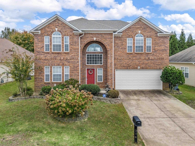 view of front of house featuring a front lawn and a garage