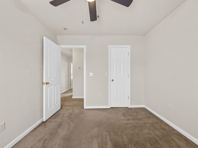 unfurnished bedroom with carpet flooring and ceiling fan